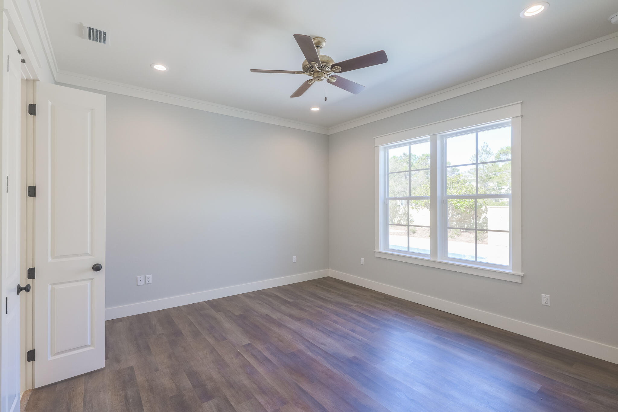65 Horseshoe Circle Miramar Beach, FL 32550 - Photo 18 of 41 wooden floor in an empty room with a window