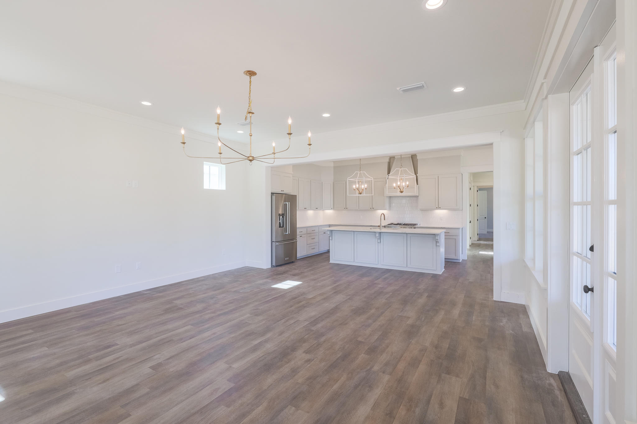 65 Horseshoe Circle Miramar Beach, FL 32550 - Photo 6 of 41 a view of a kitchen with wooden floor and windows