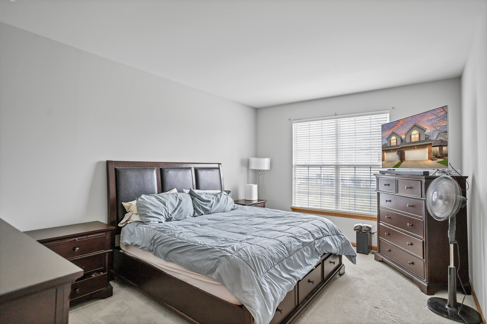 848 Pheasant Trail St. Charles, IL 60174 - Photo 16 of 30 a bedroom with a bed and dresser