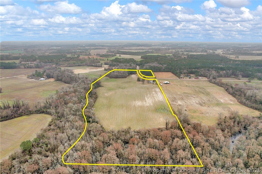 Pittman Loop Road Fairmont, NC 28340 - Photo 5 of 14 a view of a swimming pool with a yard