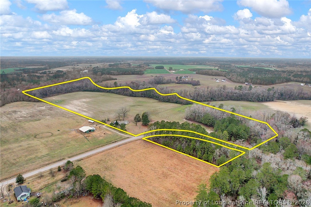 Pittman Loop Road Fairmont, NC 28340 - Photo 9 of 14 a view of swimming pool with a yard and seating space