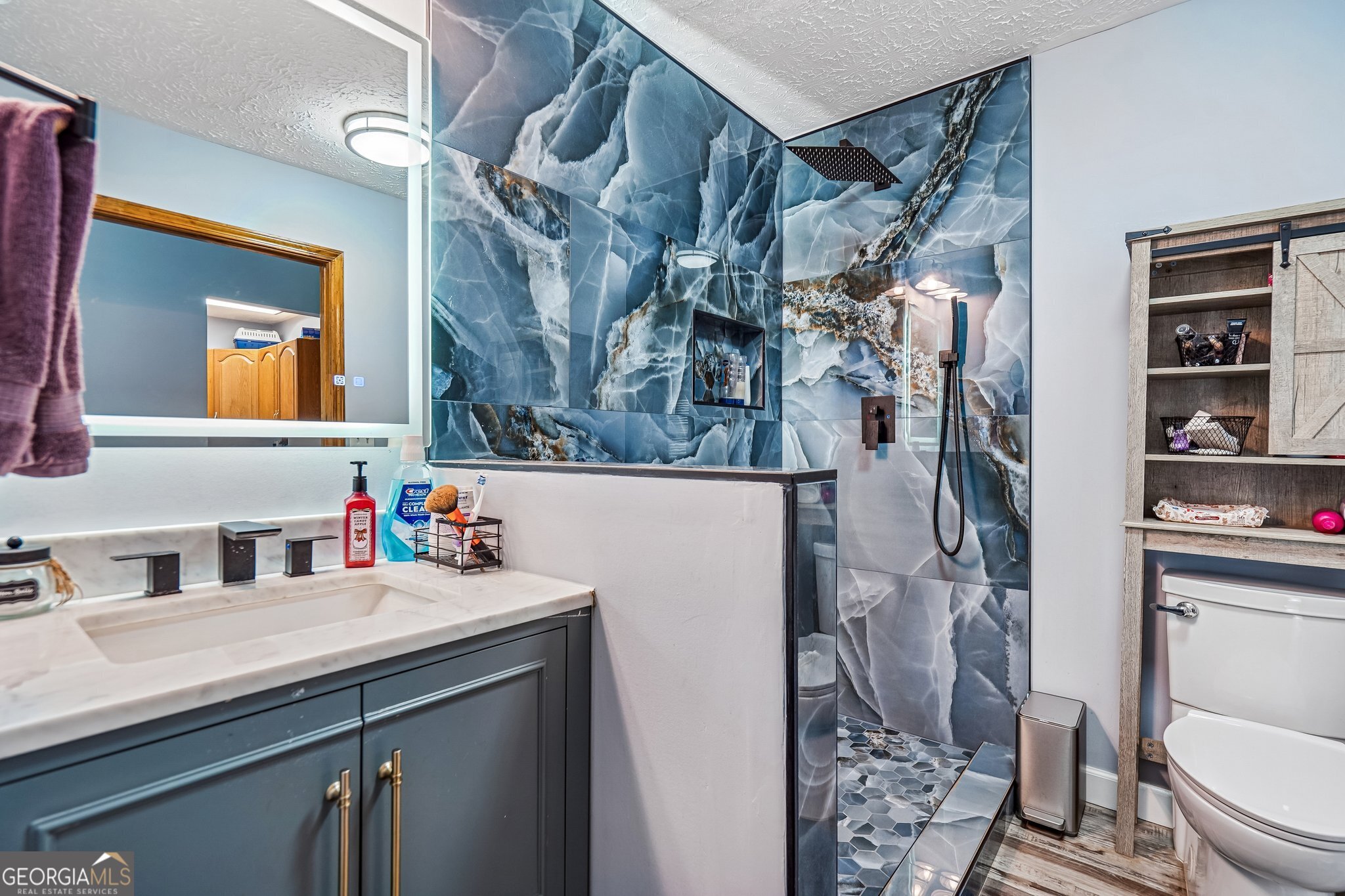 241 Busbin Road Fayetteville, GA 30215 - Photo 22 of 45 a bathroom with a sink toilet and shower