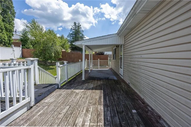 a view of a chair and table in backyard