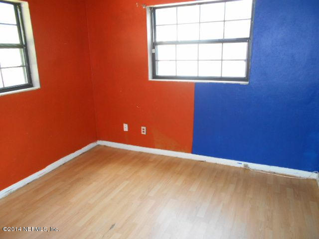 2916 Kent Road Jacksonville, FL 32216 - Photo 11 of 15 an empty room with a empty space and a window