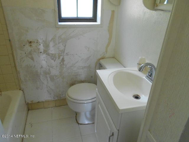 2916 Kent Road Jacksonville, FL 32216 - Photo 12 of 15 a white toilet sitting next to a white sink
