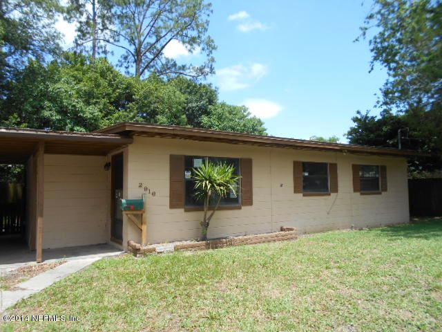 2916 Kent Road Jacksonville, FL 32216 - Photo 13 of 15 a house that has a tree in front of it