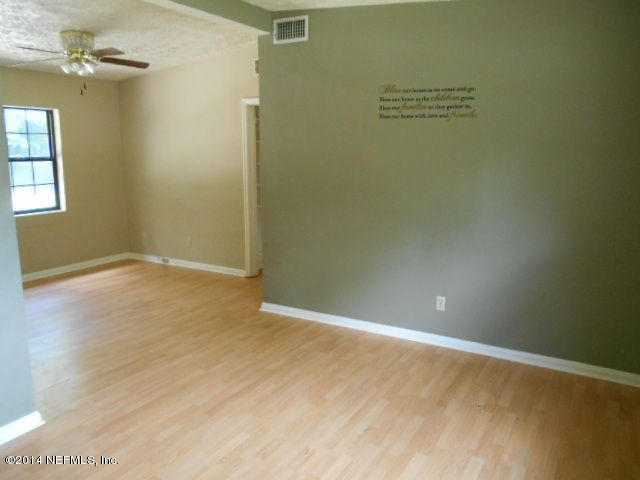 2916 Kent Road Jacksonville, FL 32216 - Photo 4 of 15 an empty room with windows