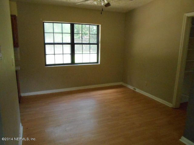2916 Kent Road Jacksonville, FL 32216 - Photo 6 of 15 an empty room with a window