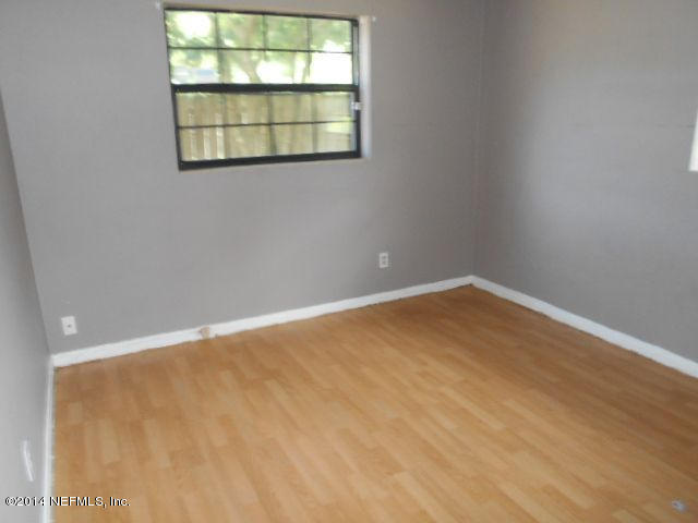 2916 Kent Road Jacksonville, FL 32216 - Photo 10 of 15 an empty room with a window