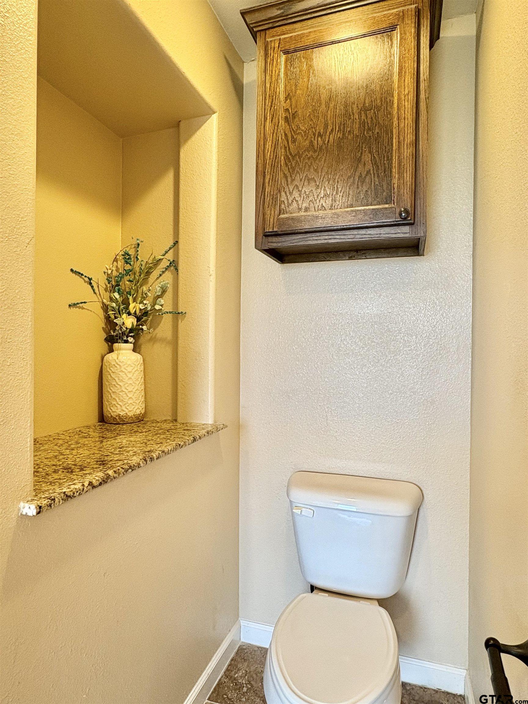 28 County Road 3101 Pittsburg, TX 75686 - Photo 19 of 39 a bathroom with a toilet and a sink