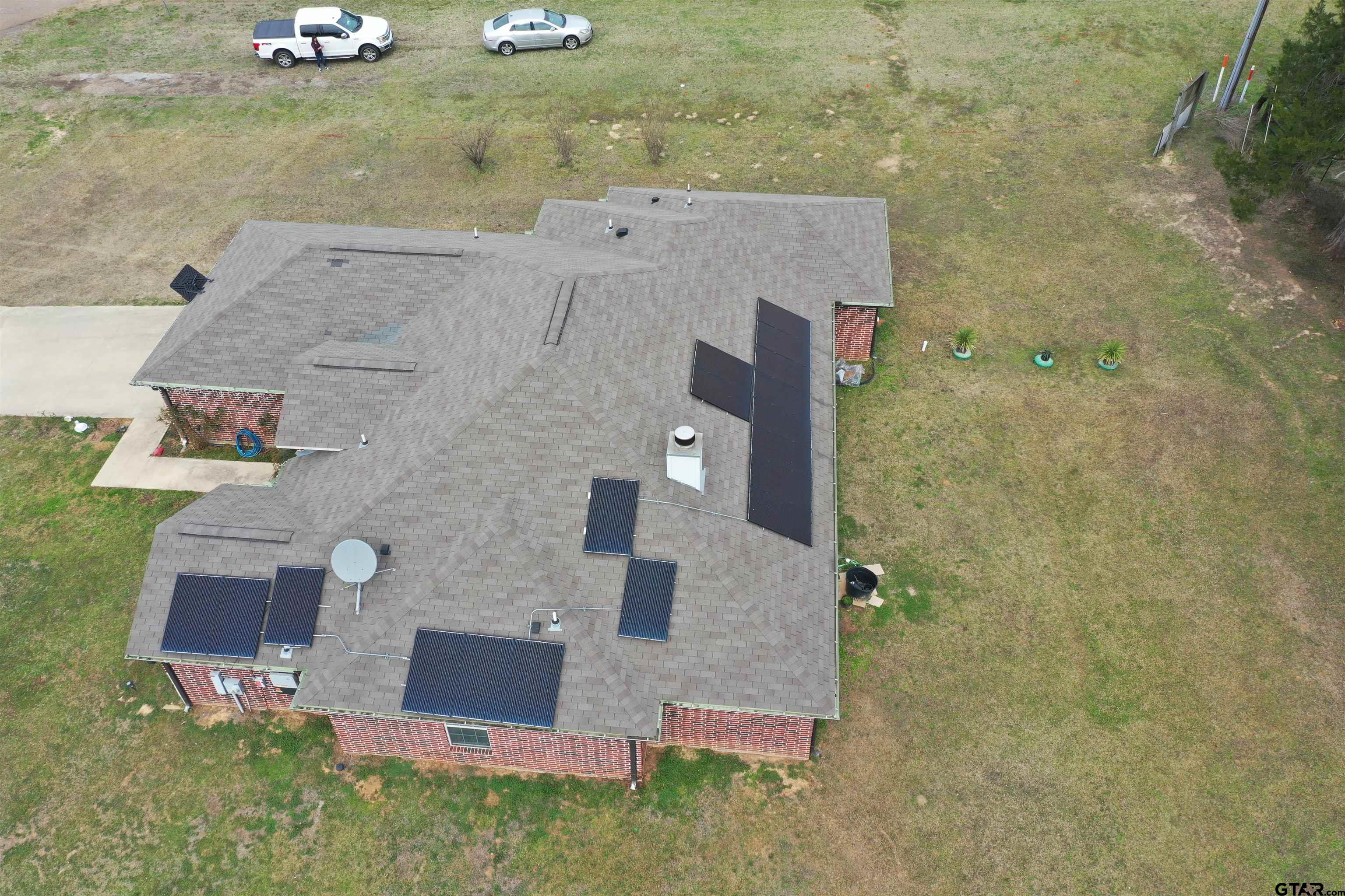 28 County Road 3101 Pittsburg, TX 75686 - Photo 2 of 39 an aerial view of a house with a yard
