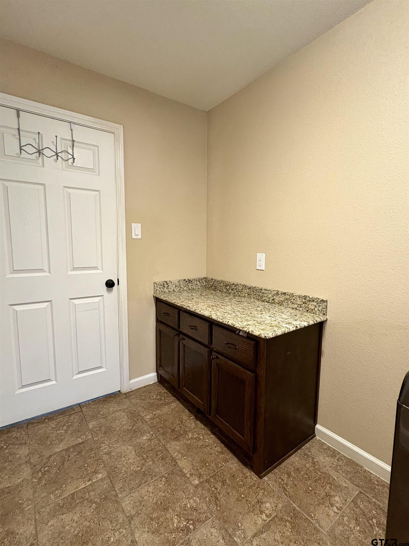 28 County Road 3101 Pittsburg, TX 75686 - Photo 32 of 39 a view of kitchen with granite countertop cabinets and sink