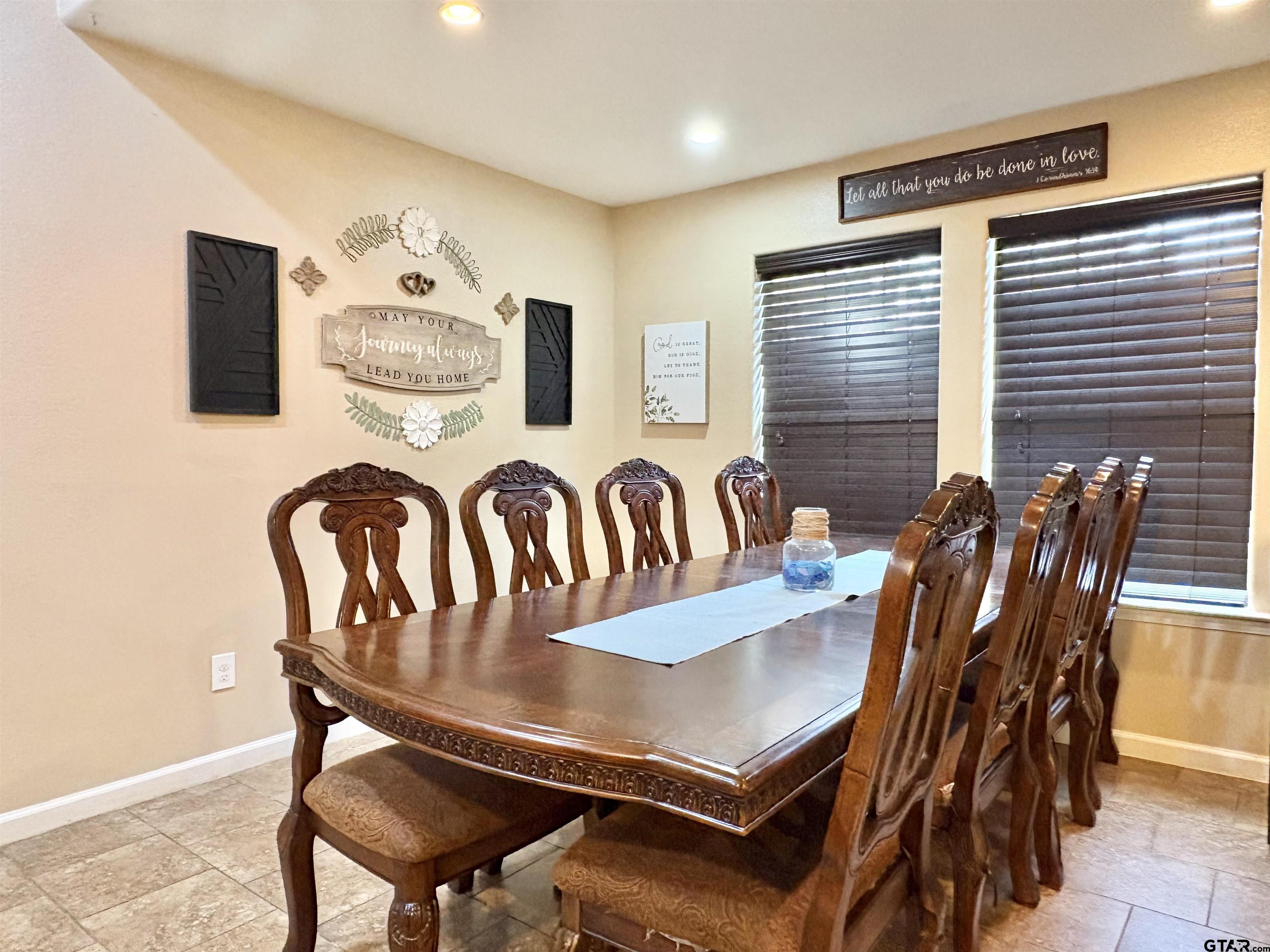 28 County Road 3101 Pittsburg, TX 75686 - Photo 8 of 39 a view of a dining room with furniture