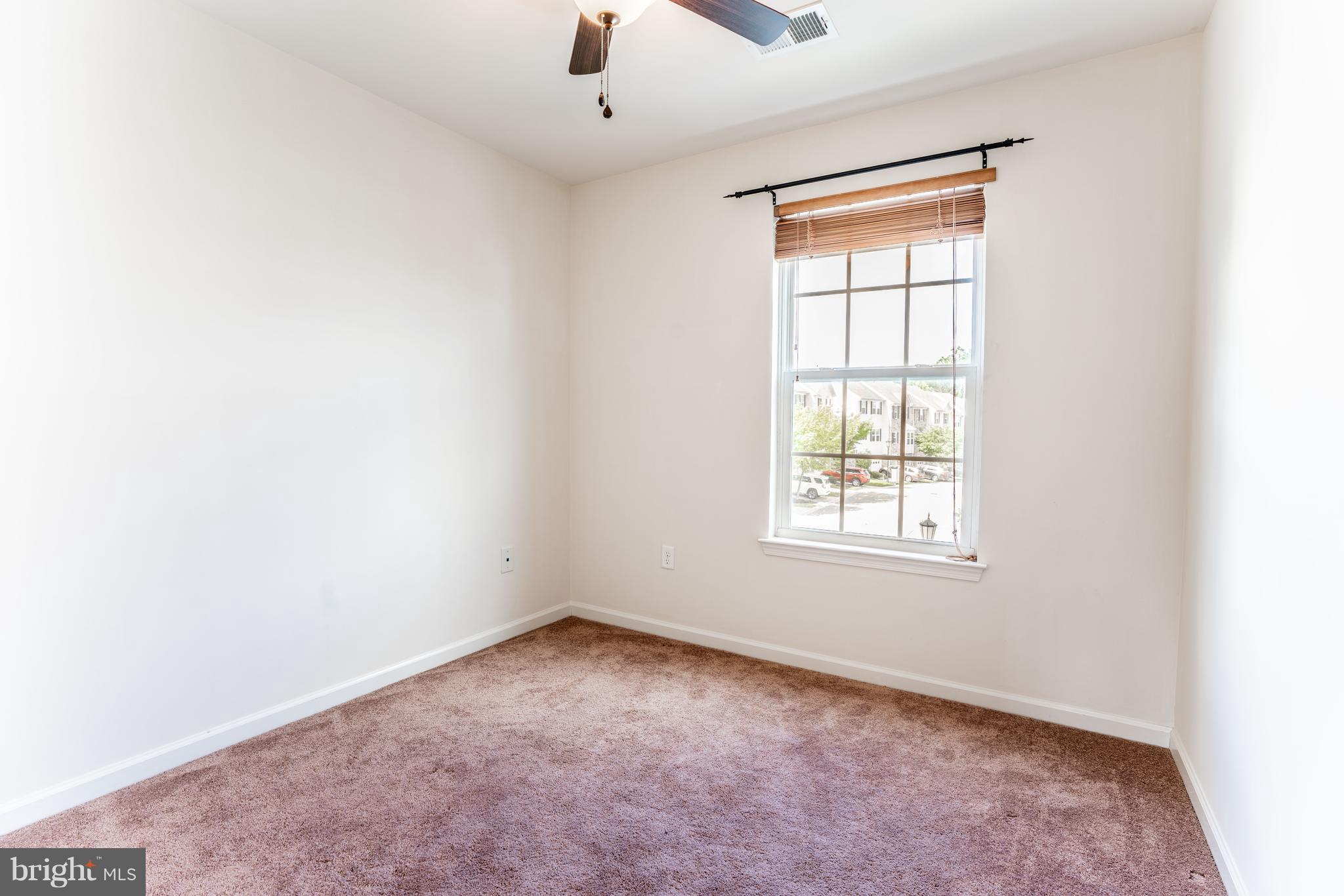 6876 Tasker Falls, Unit 77 Elkridge, MD 21075 - Photo 20 of 30 an empty room with a window
