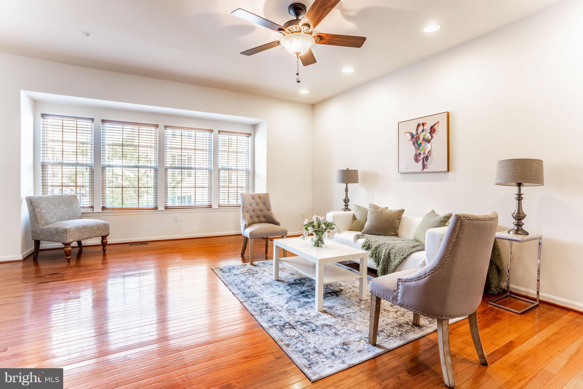 6876 Tasker Falls, Unit 77 Elkridge, MD 21075 - Photo 6 of 30 a living room with furniture and a large window