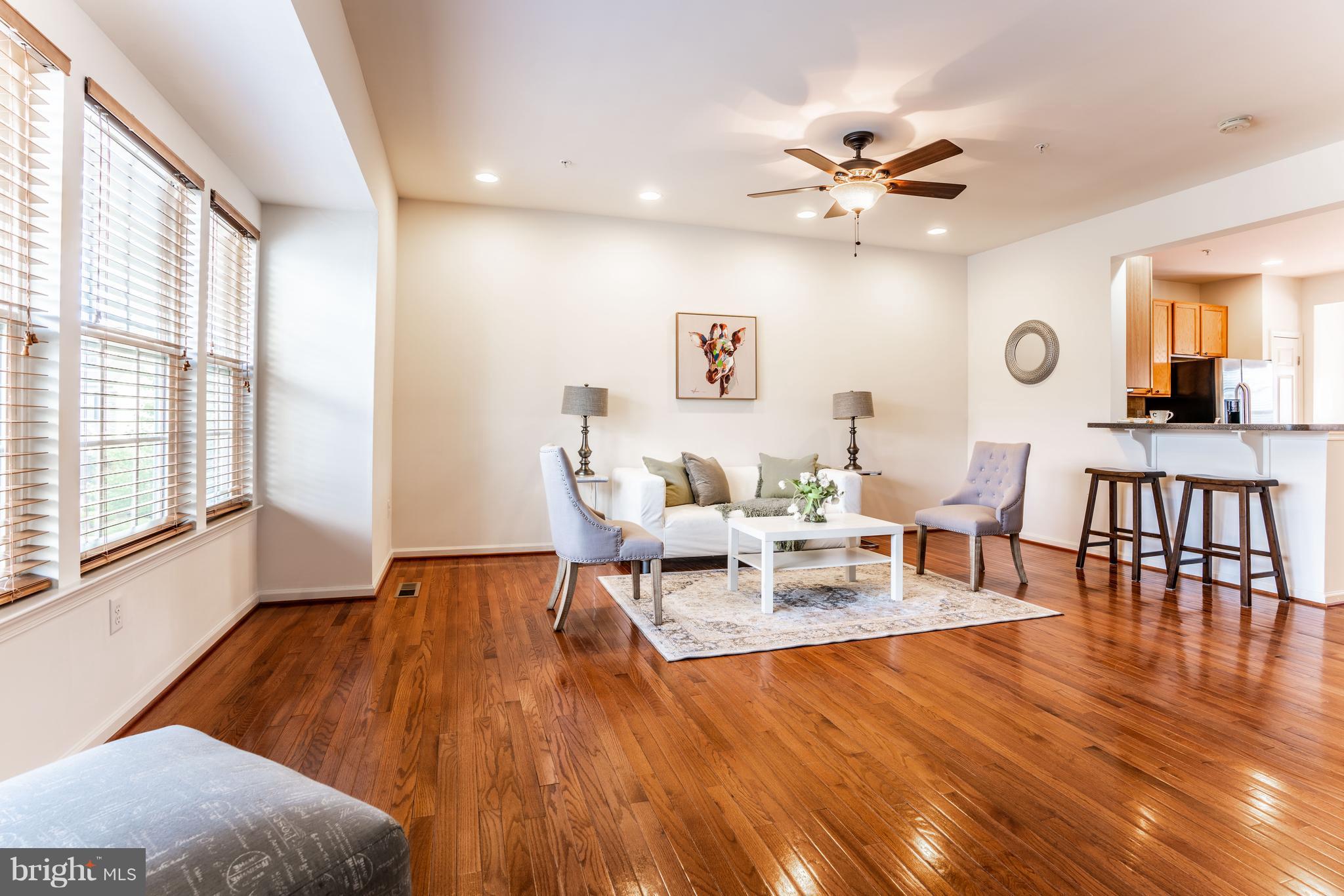 6876 Tasker Falls, Unit 77 Elkridge, MD 21075 - Photo 7 of 30 a living room with furniture and a large window