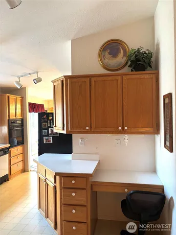 a kitchen with a sink and a stove