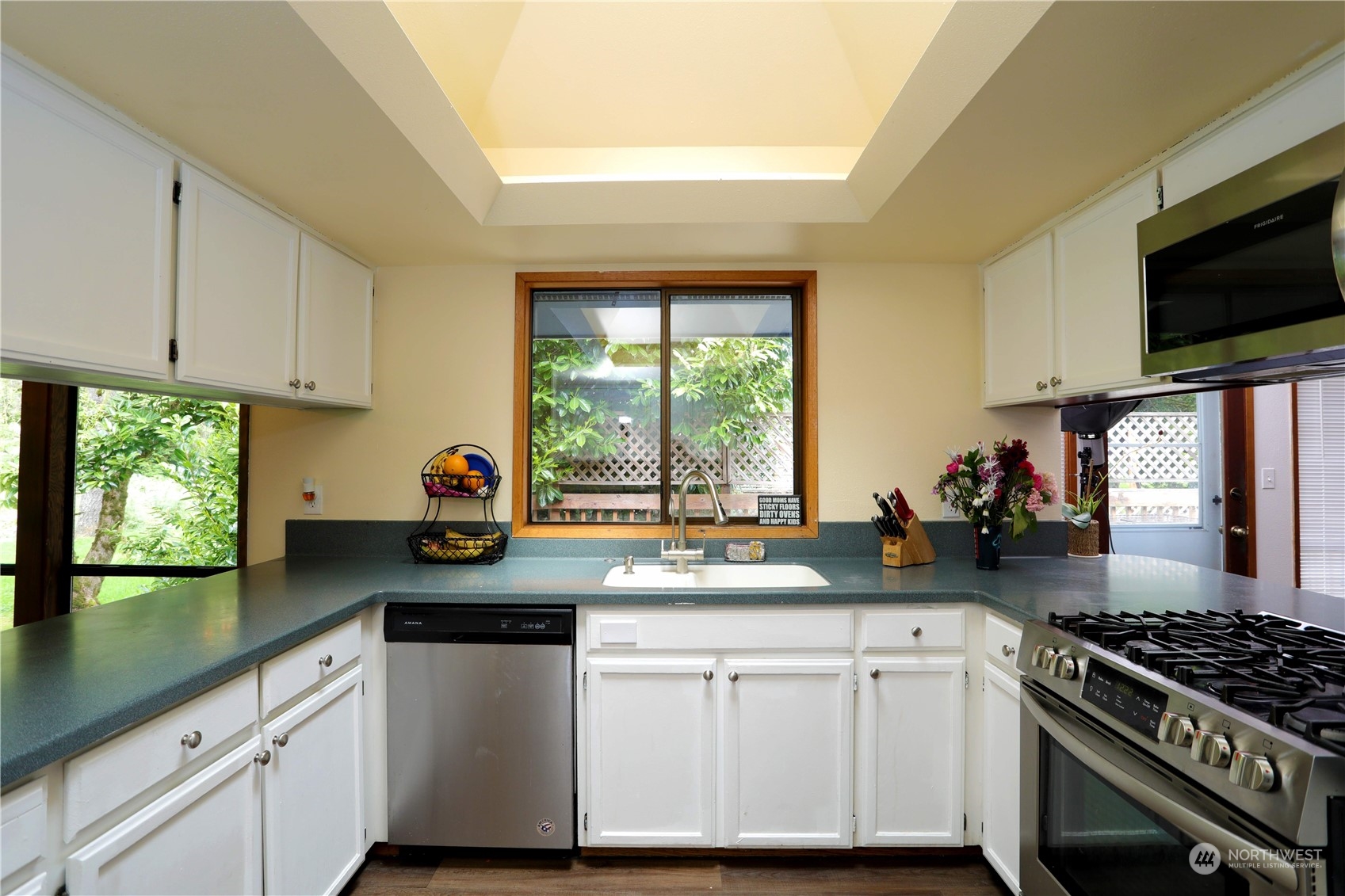12503 Issaquah-Hobart Road Southeast Issaquah, WA 98027 - Photo 16 of 39 a kitchen with sink a stove and microwave