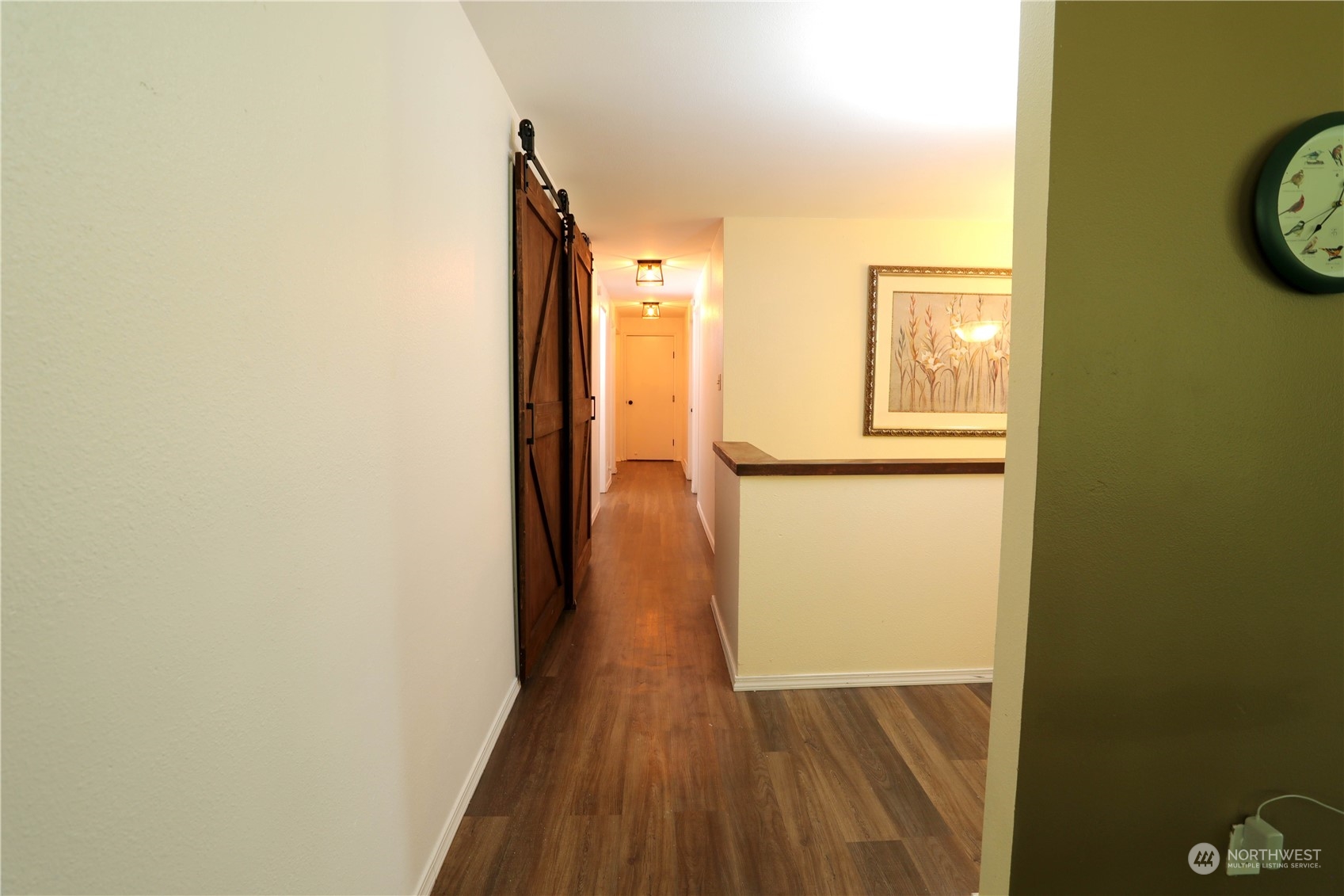 12503 Issaquah-Hobart Road Southeast Issaquah, WA 98027 - Photo 24 of 39 a view of a hallway with wooden floor
