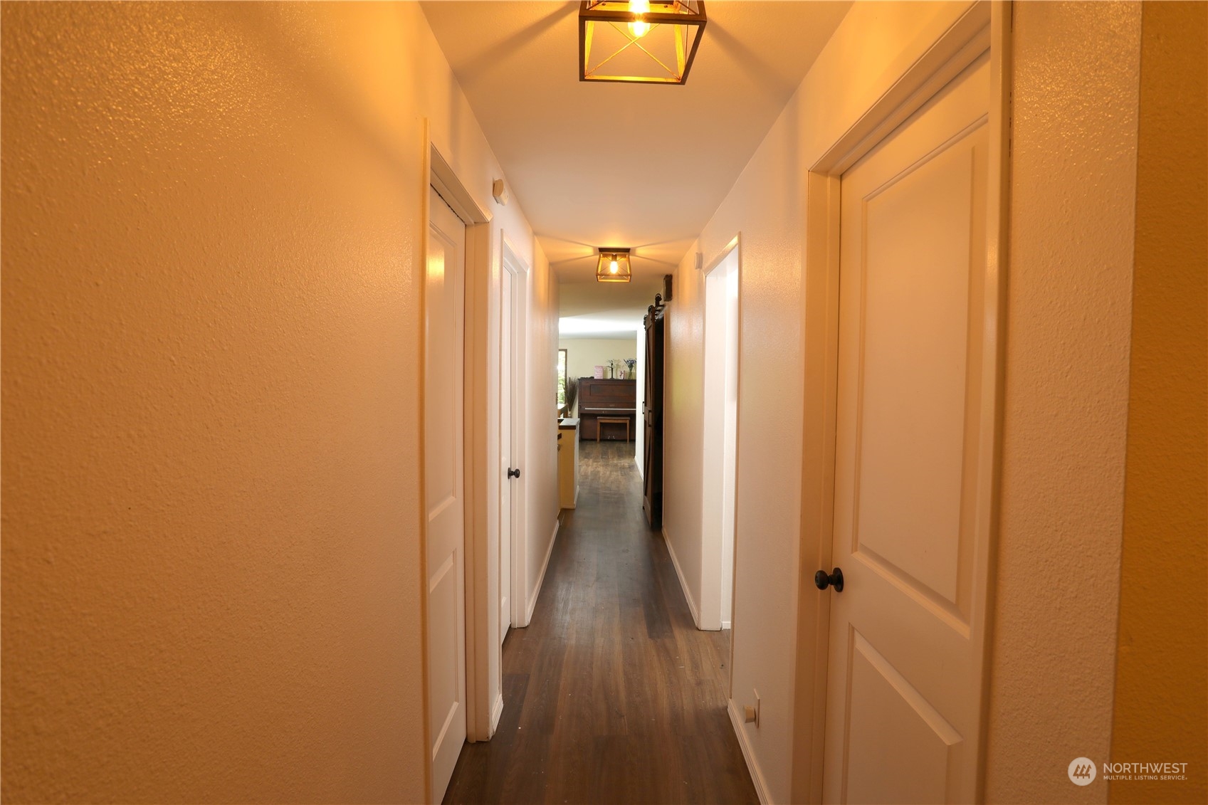 12503 Issaquah-Hobart Road Southeast Issaquah, WA 98027 - Photo 25 of 39 a view of a hallway with wooden floor
