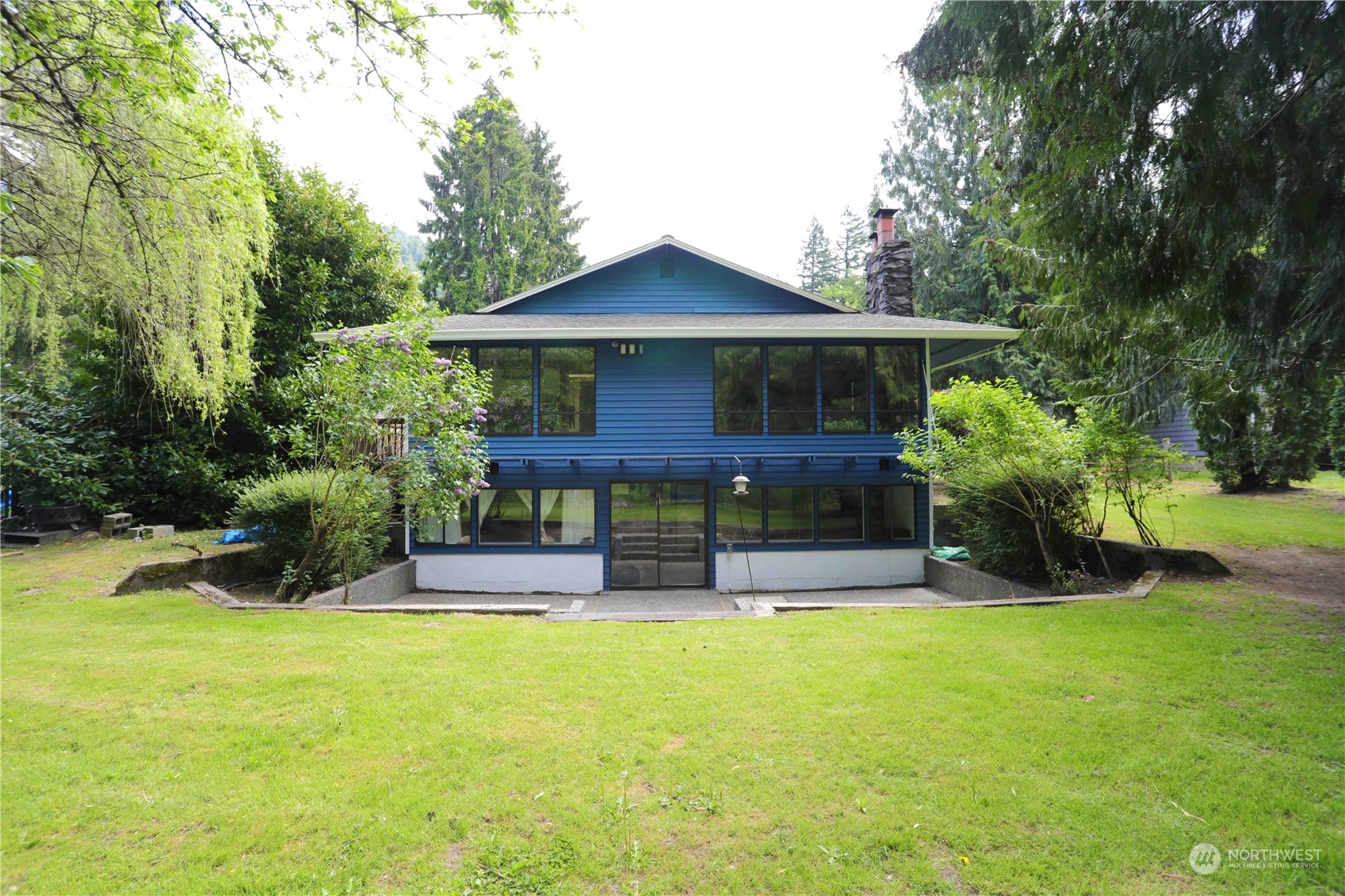 12503 Issaquah-Hobart Road Southeast Issaquah, WA 98027 - Photo 8 of 39 a view of house with outdoor seating and yard