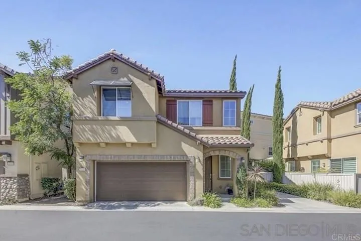1535 Chert Drive San Marcos, CA 92078 - Photo 1 of 24 a front view of a house with a yard and garage