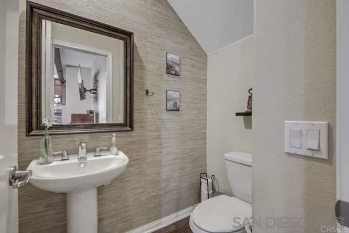 1535 Chert Drive San Marcos, CA 92078 - Photo 11 of 24 a bathroom with a toilet sink and mirror