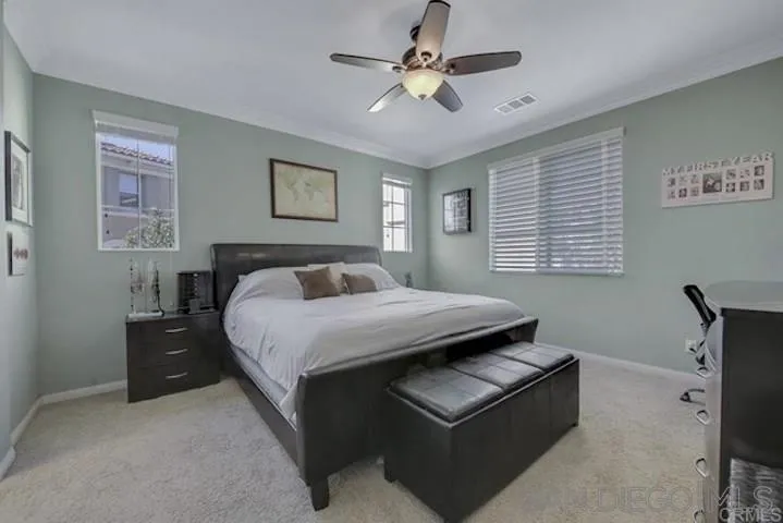 1535 Chert Drive San Marcos, CA 92078 - Photo 8 of 24 a bedroom with a bed and a chandelier