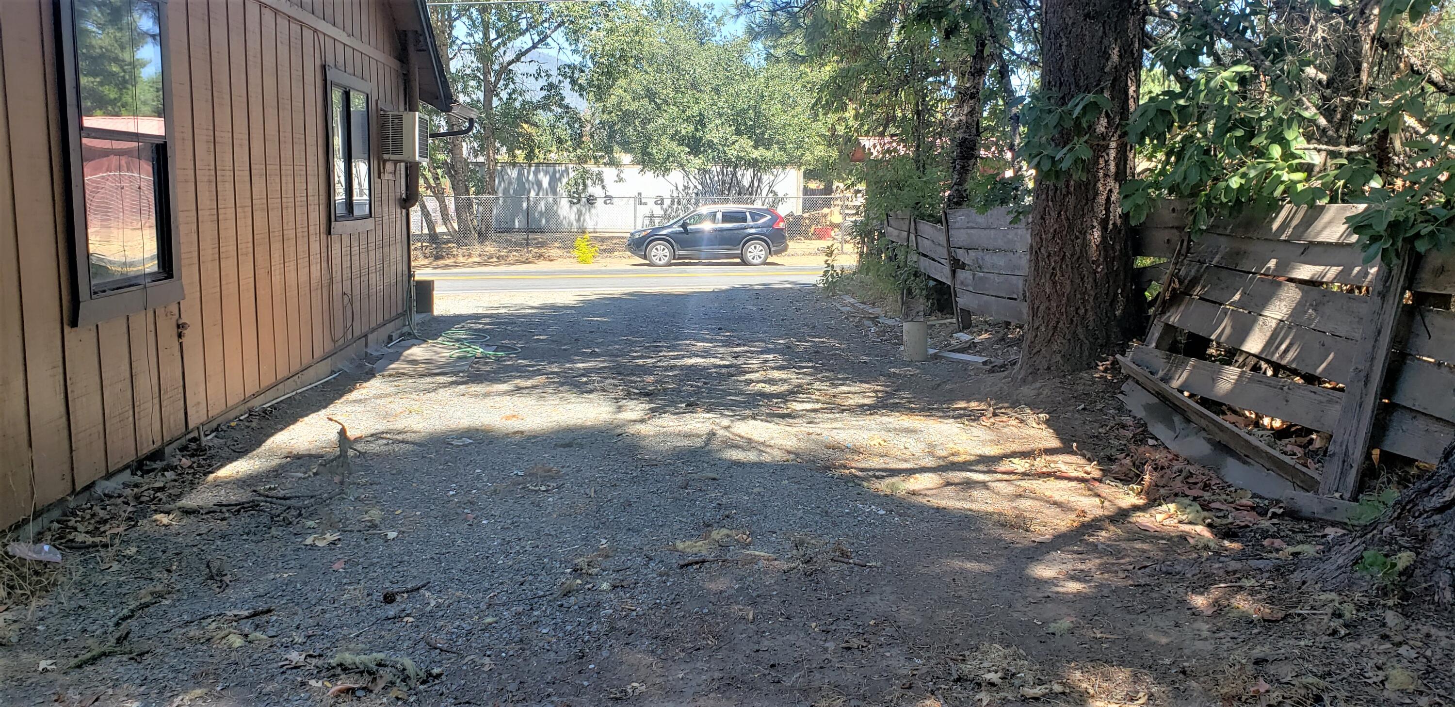 201 Finch Road Cave Junction, OR 97531 - Photo 12 of 12 other side yard- driveway