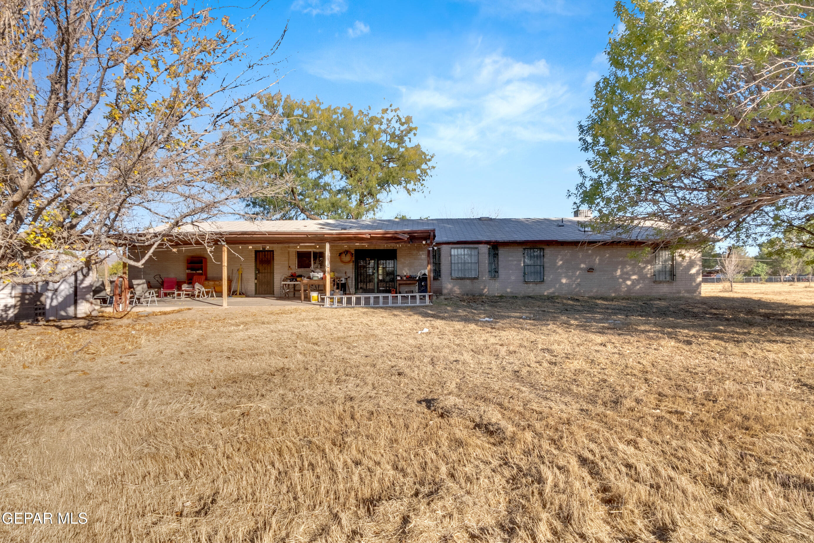 299 Tranquility Road Canutillo, TX 79835 - Photo 13 of 55 front view of a house with a yard