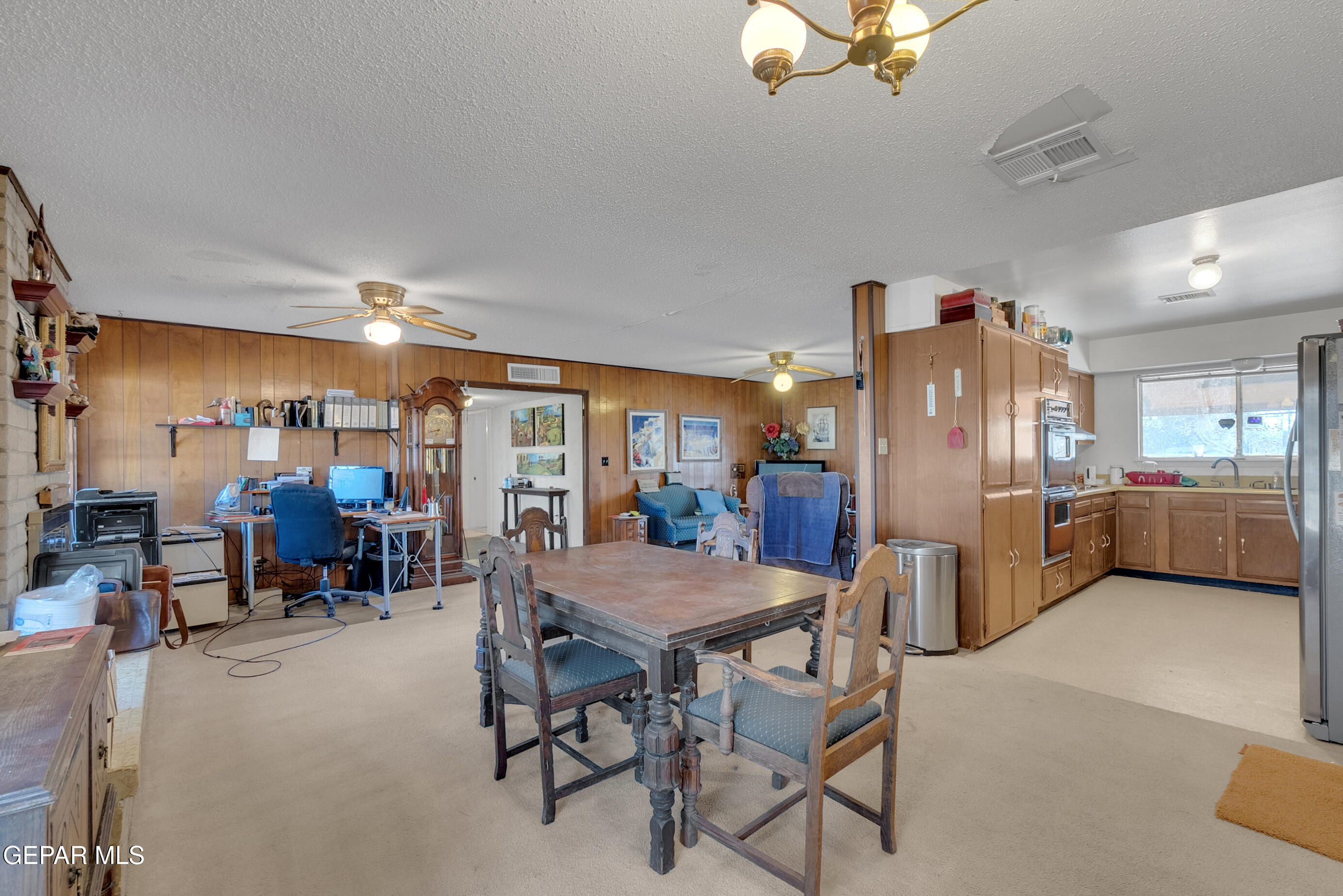 299 Tranquility Road Canutillo, TX 79835 - Photo 21 of 55 a view of a dining room with furniture and chandelier