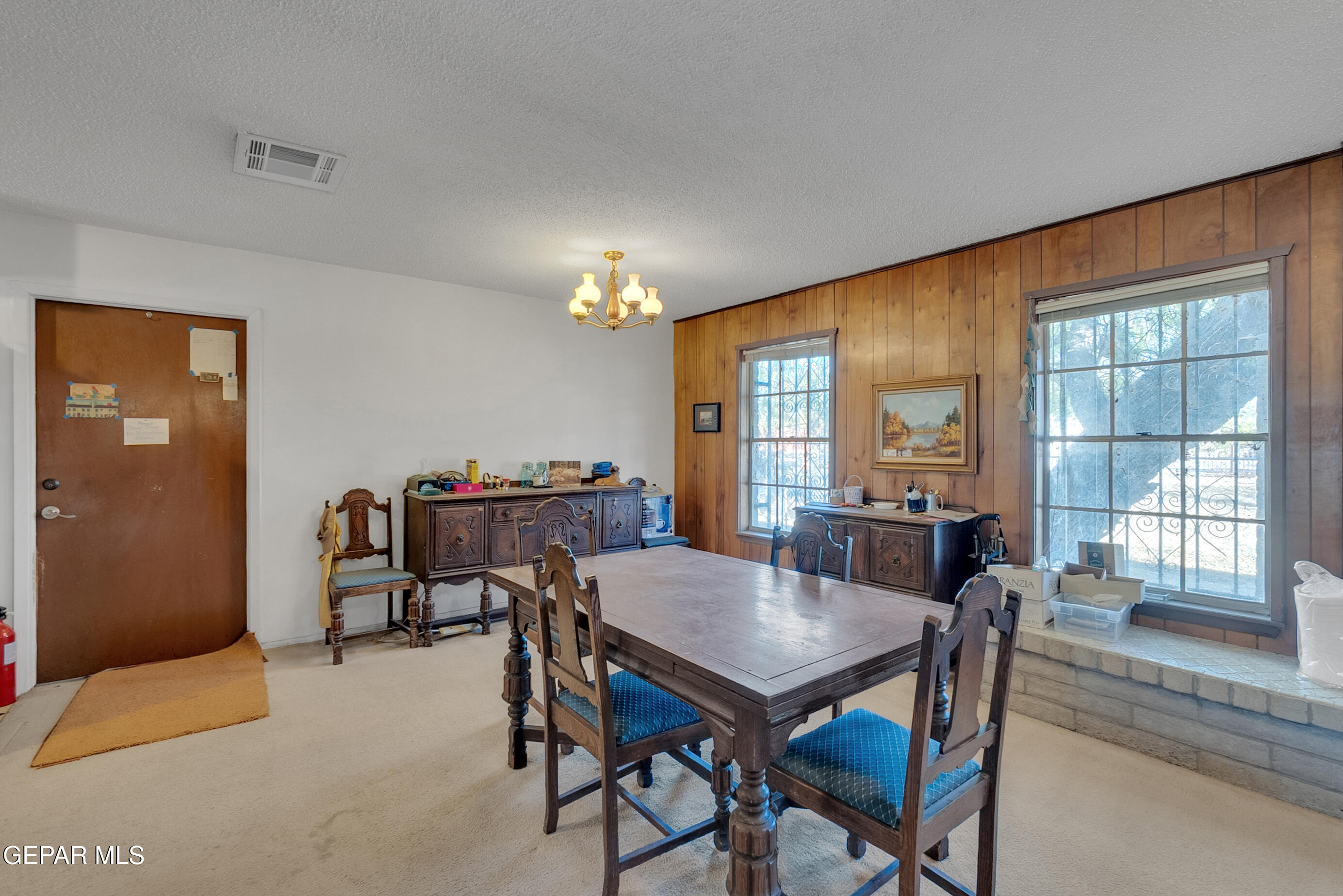 299 Tranquility Road Canutillo, TX 79835 - Photo 36 of 55 a view of a dining room with furniture and window