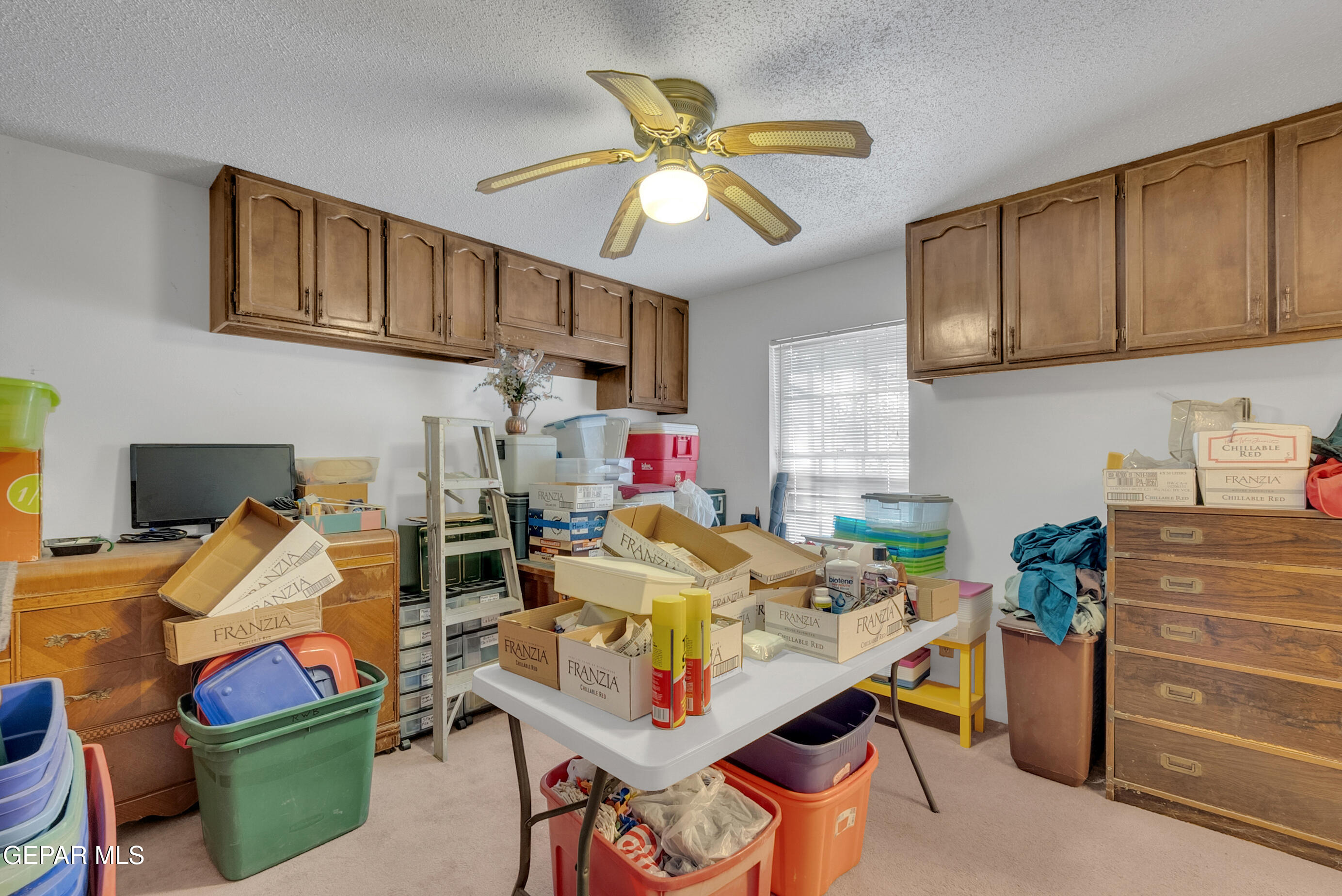 299 Tranquility Road Canutillo, TX 79835 - Photo 39 of 55 a work place with granite countertop furniture and a chandelier