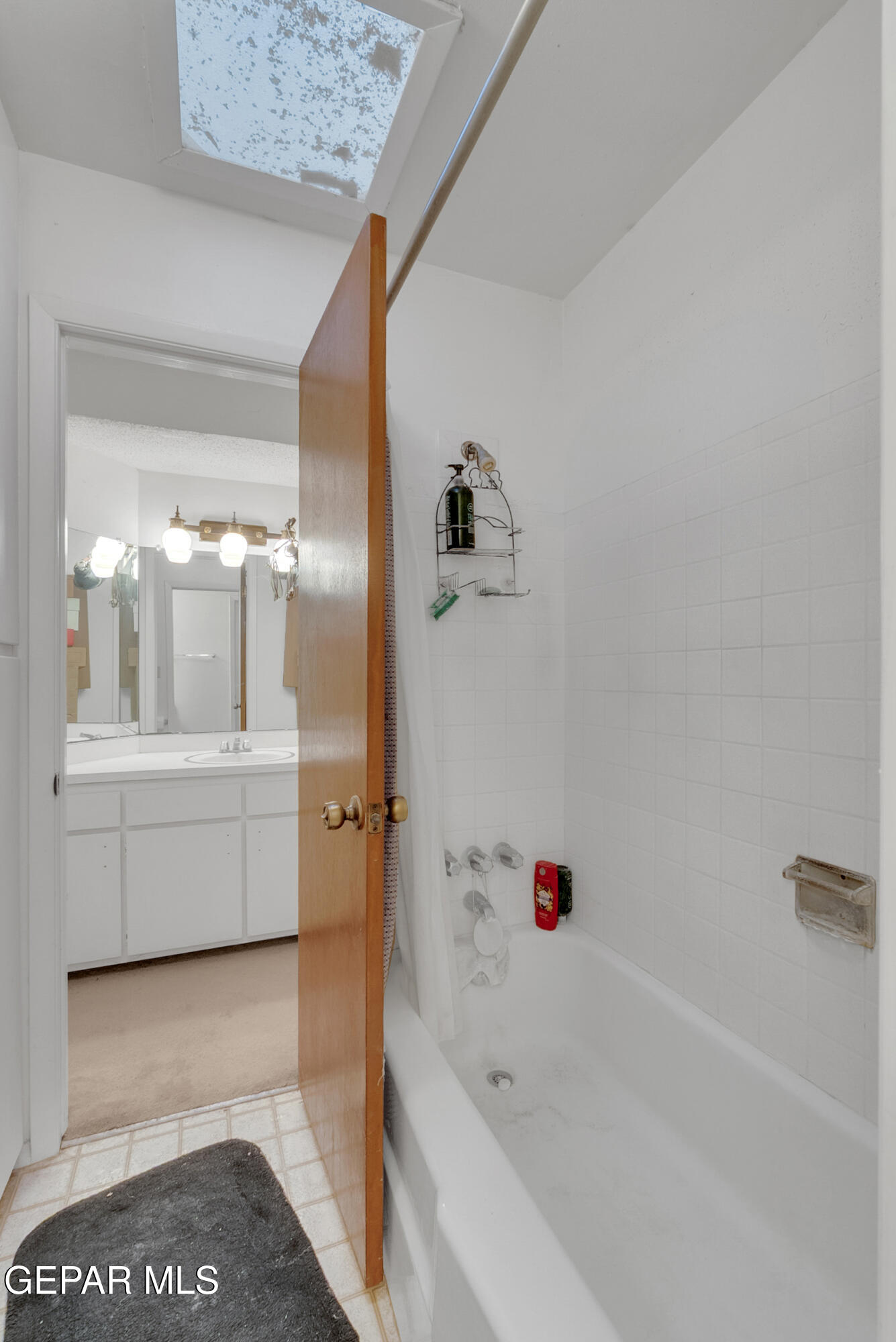 299 Tranquility Road Canutillo, TX 79835 - Photo 44 of 55 a bathroom with a tub a sink and a large mirror