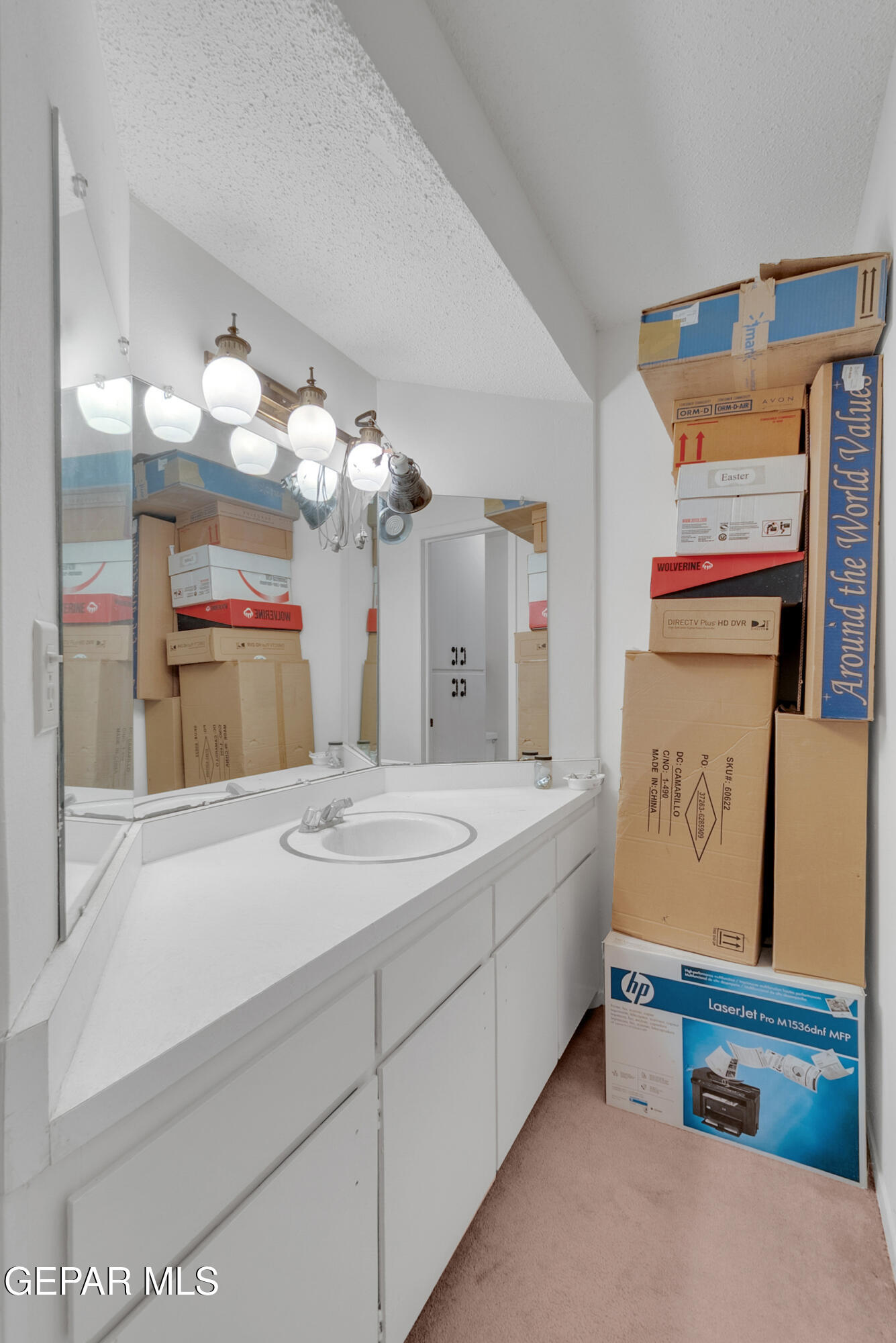 299 Tranquility Road Canutillo, TX 79835 - Photo 47 of 55 a spacious bathroom with a sink a large mirror and a shower