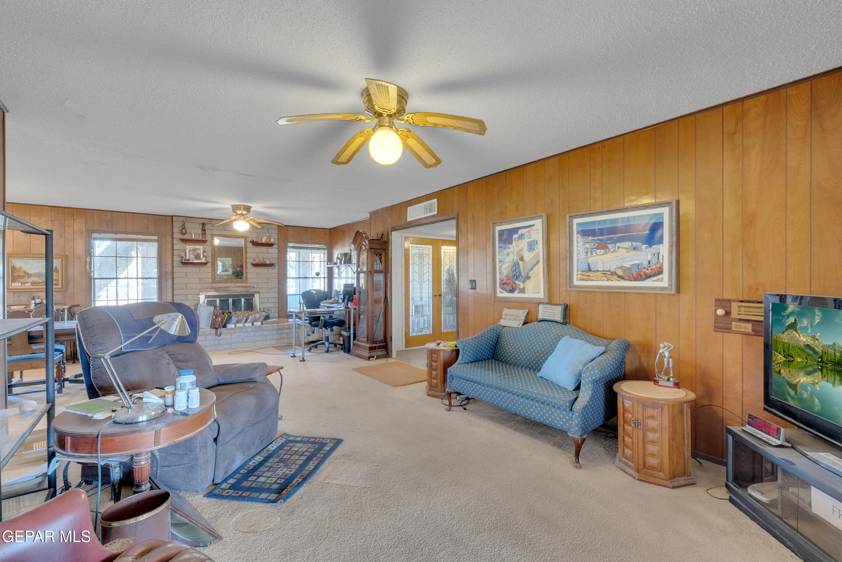 299 Tranquility Road Canutillo, TX 79835 - Photo 6 of 55 a living room with furniture and a flat screen tv