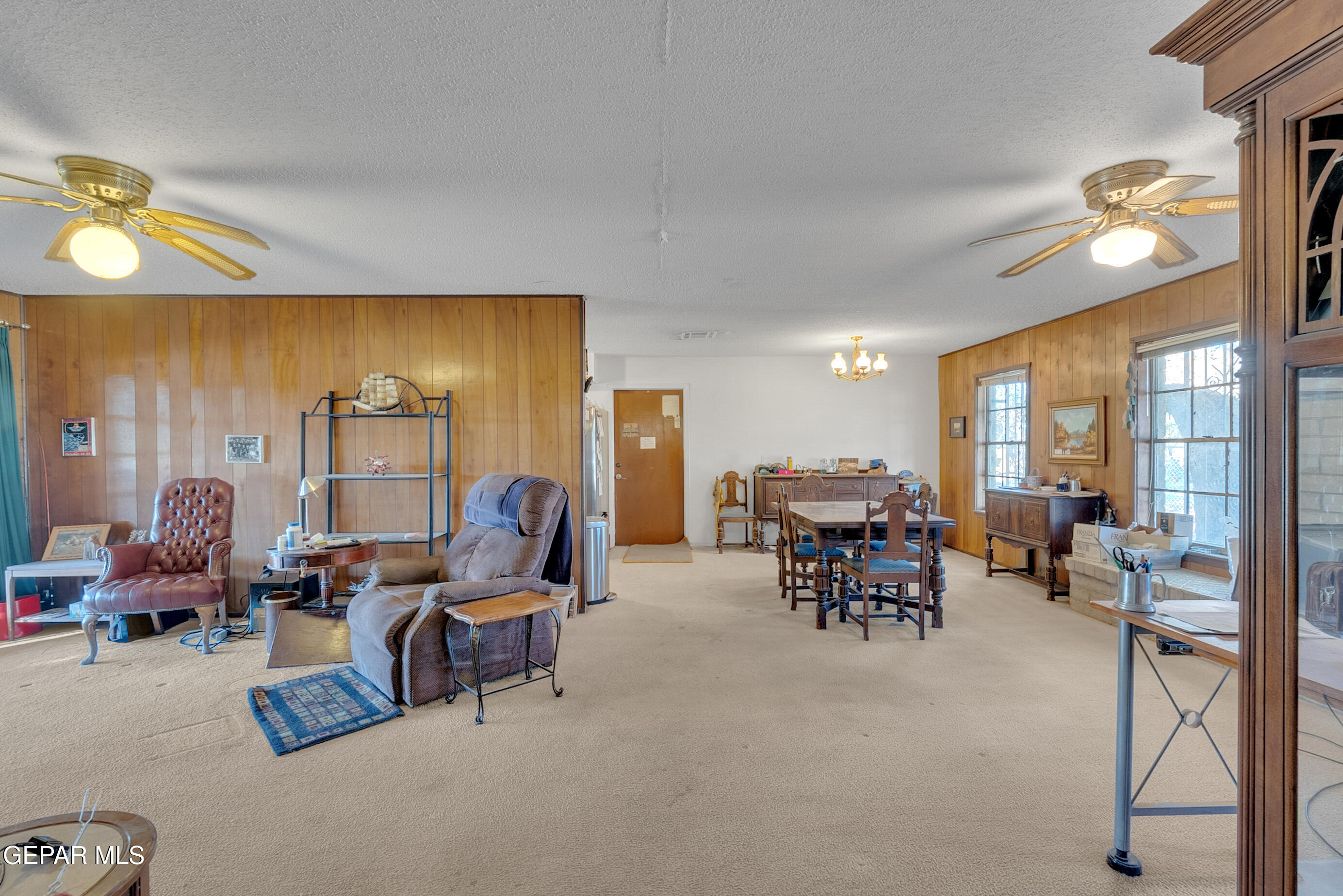 299 Tranquility Road Canutillo, TX 79835 - Photo 8 of 55 a living room with furniture and a large window