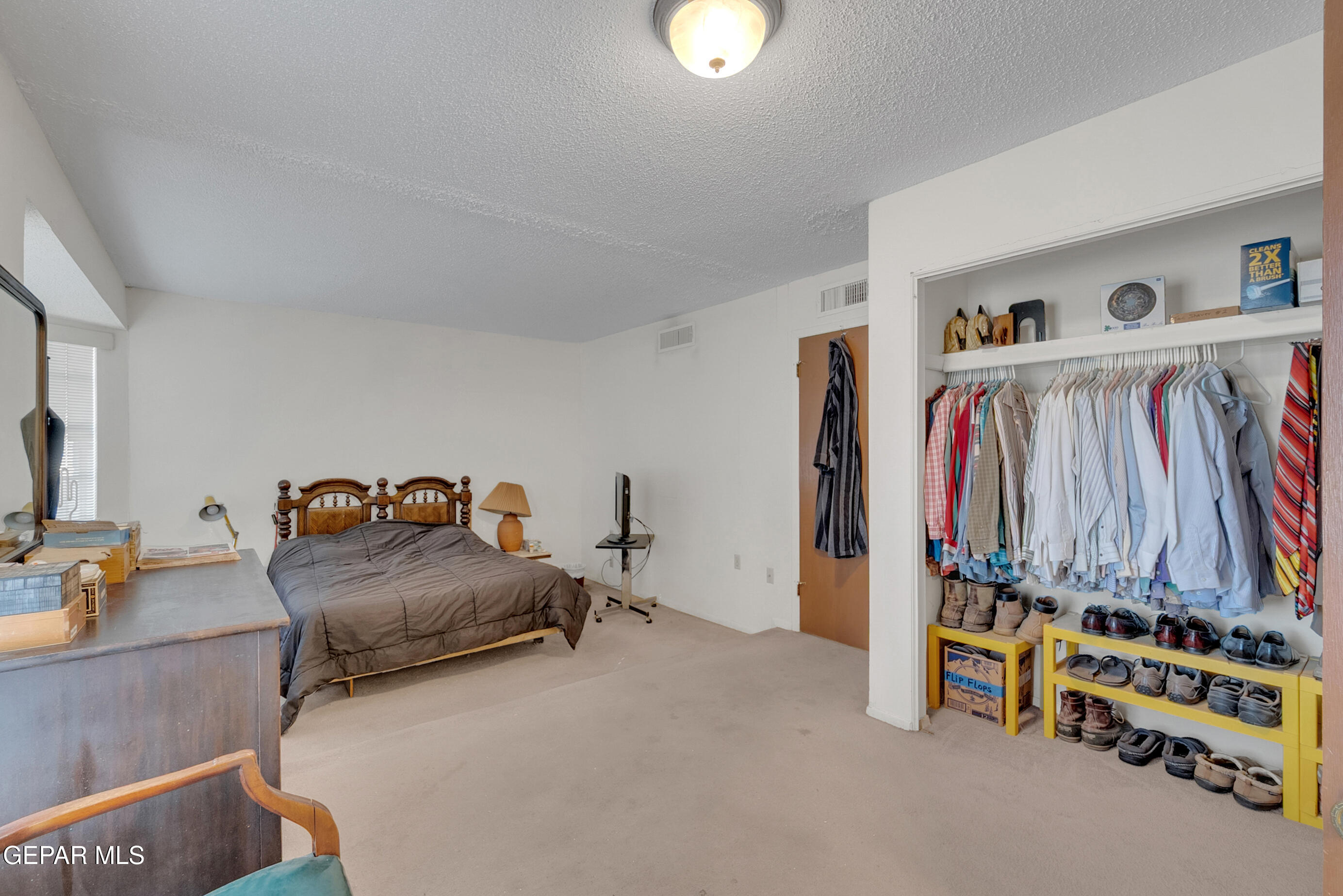 299 Tranquility Road Canutillo, TX 79835 - Photo 9 of 55 a bedroom with bed and a window