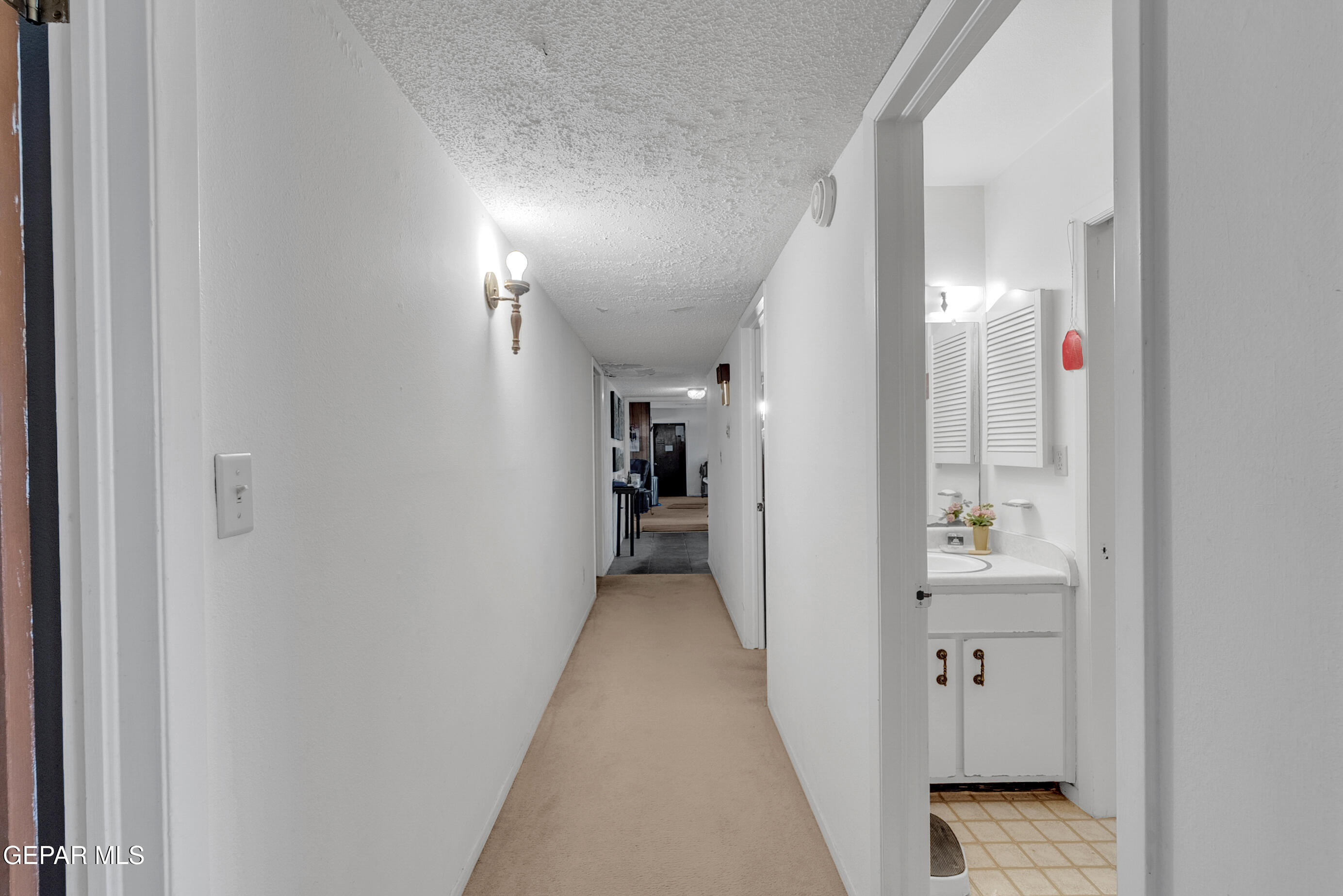 299 Tranquility Road Canutillo, TX 79835 - Photo 10 of 55 a view of a hallway with wooden floor