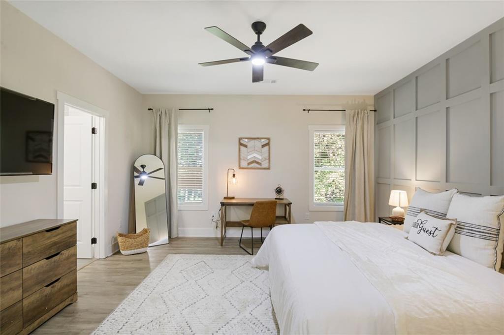 4620 Timrose Road Northwest Kennesaw, GA 30144 - Photo 11 of 30 a bedroom with a bed a window and a flat screen tv