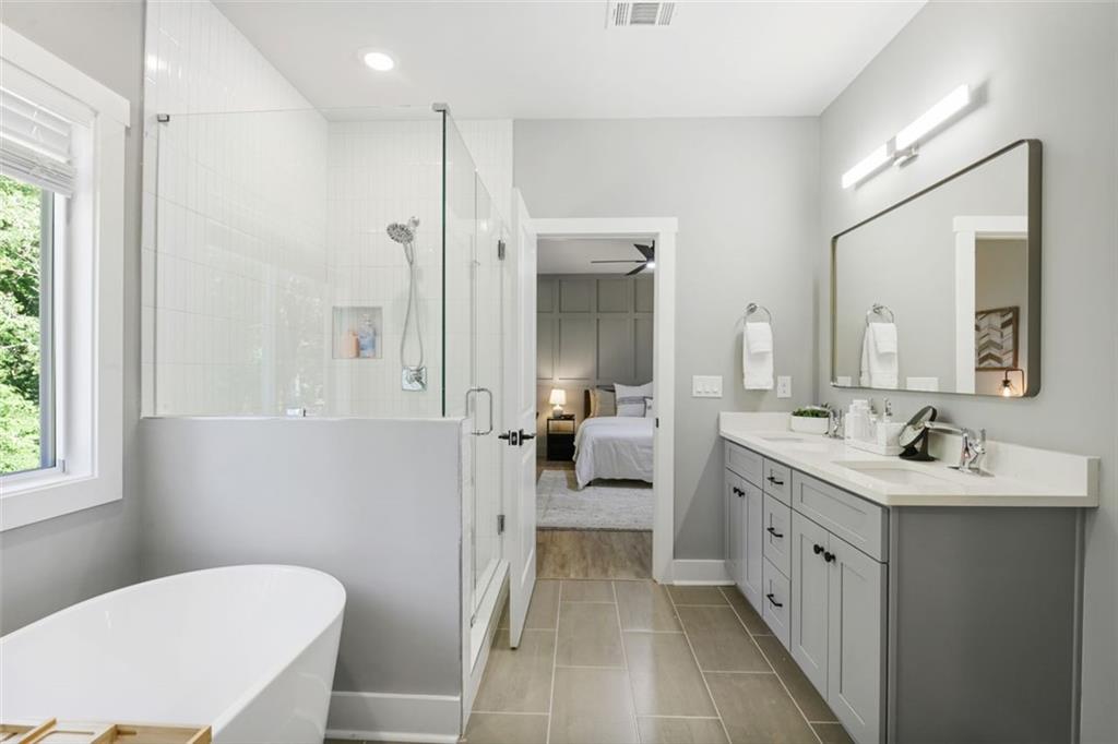 4620 Timrose Road Northwest Kennesaw, GA 30144 - Photo 12 of 30 a bathroom with a toilet a sink and mirror