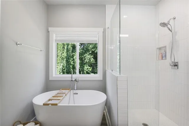a white bath tub sitting next to a window