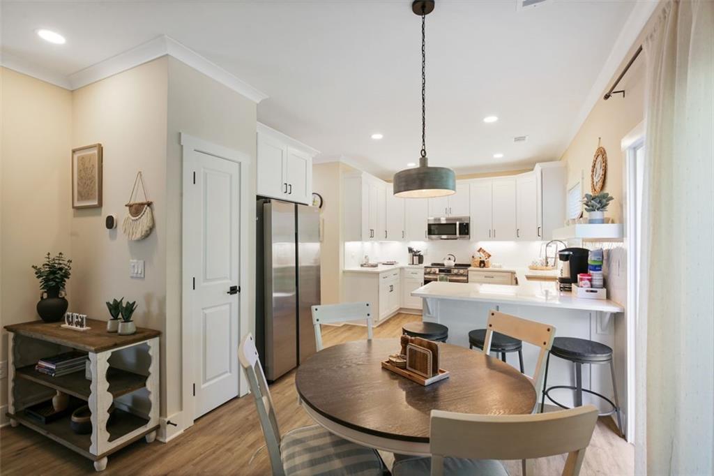 4620 Timrose Road Northwest Kennesaw, GA 30144 - Photo 2 of 30 a kitchen with stainless steel appliances granite countertop a sink a stove and refrigerator
