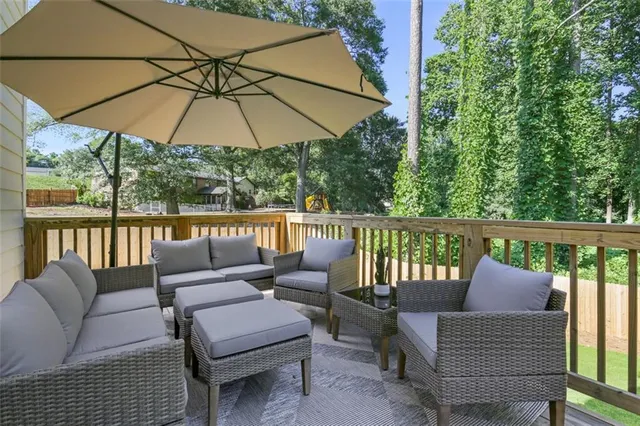 a view of a chair and tables in the back yard