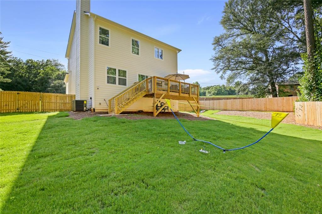 4620 Timrose Road Northwest Kennesaw, GA 30144 - Photo 25 of 30 a view of a house with a backyard