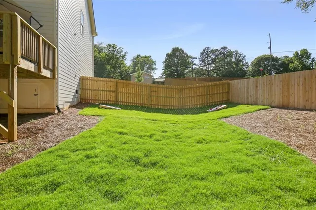 a backyard of a house with lots of green space