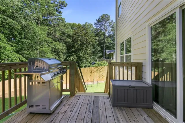a view of a balcony with wooden floor