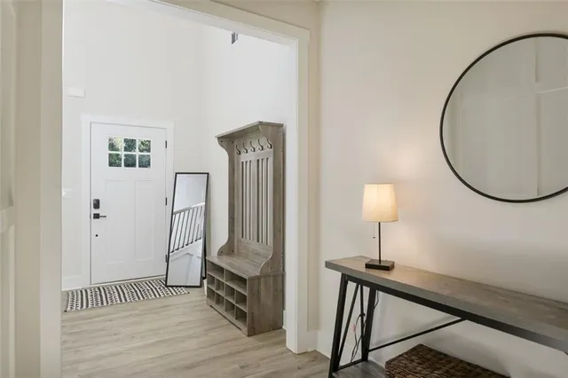 a view of a livingroom with furniture and wooden floor