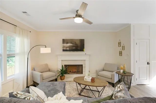 a living room with furniture and a fireplace