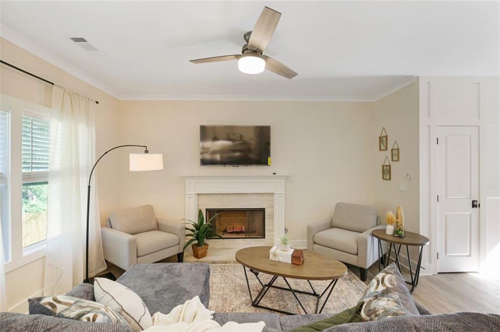 4620 Timrose Road Northwest Kennesaw, GA 30144 - Photo 9 of 30 a living room with furniture and a fireplace